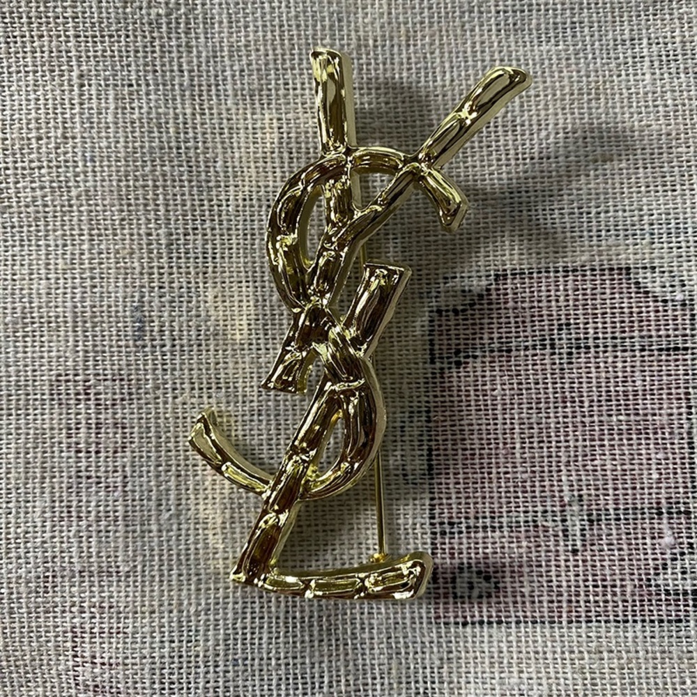 Yves Saint Laurent Gold crocodile pattern brooch